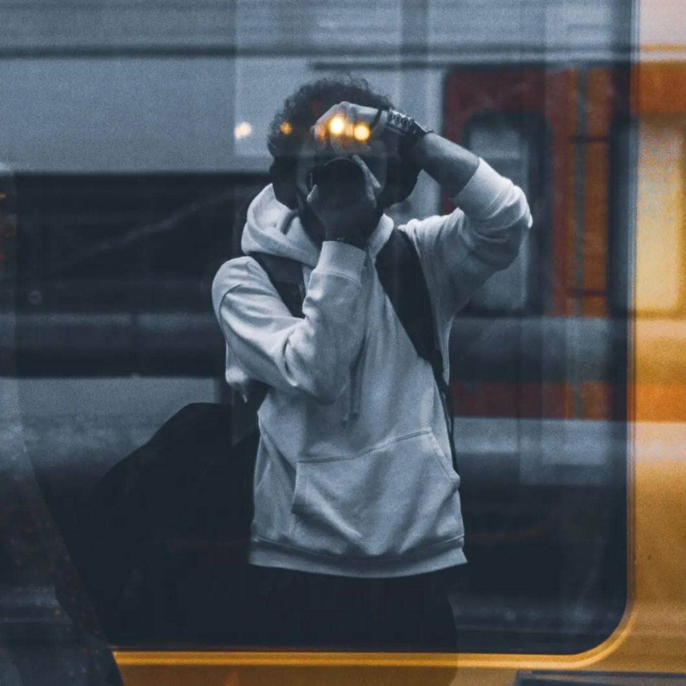Yannic Fréson photographing through a train window